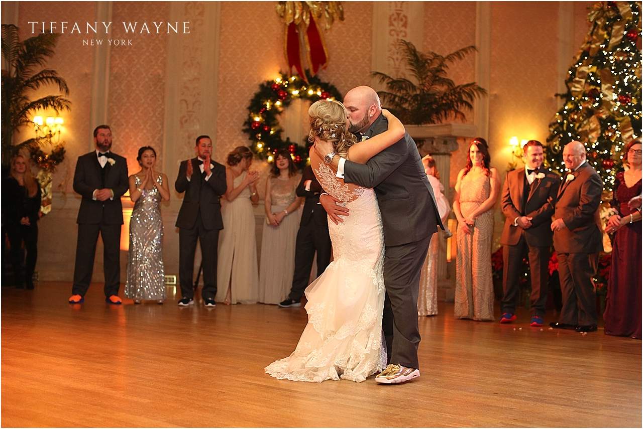 kiss on dance floor during winter Franklin Plaza wedding