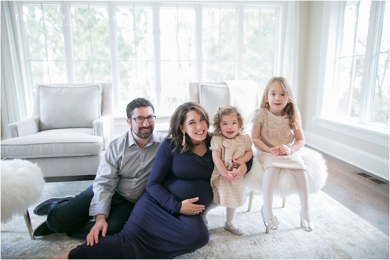 Lifestyle maternity session sitting in living room