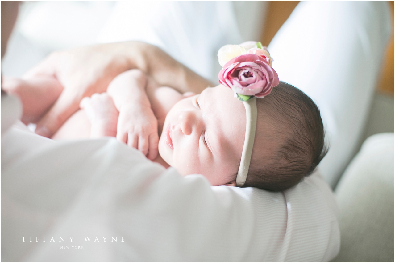 baby girl with floral headband lifestyle newborn session