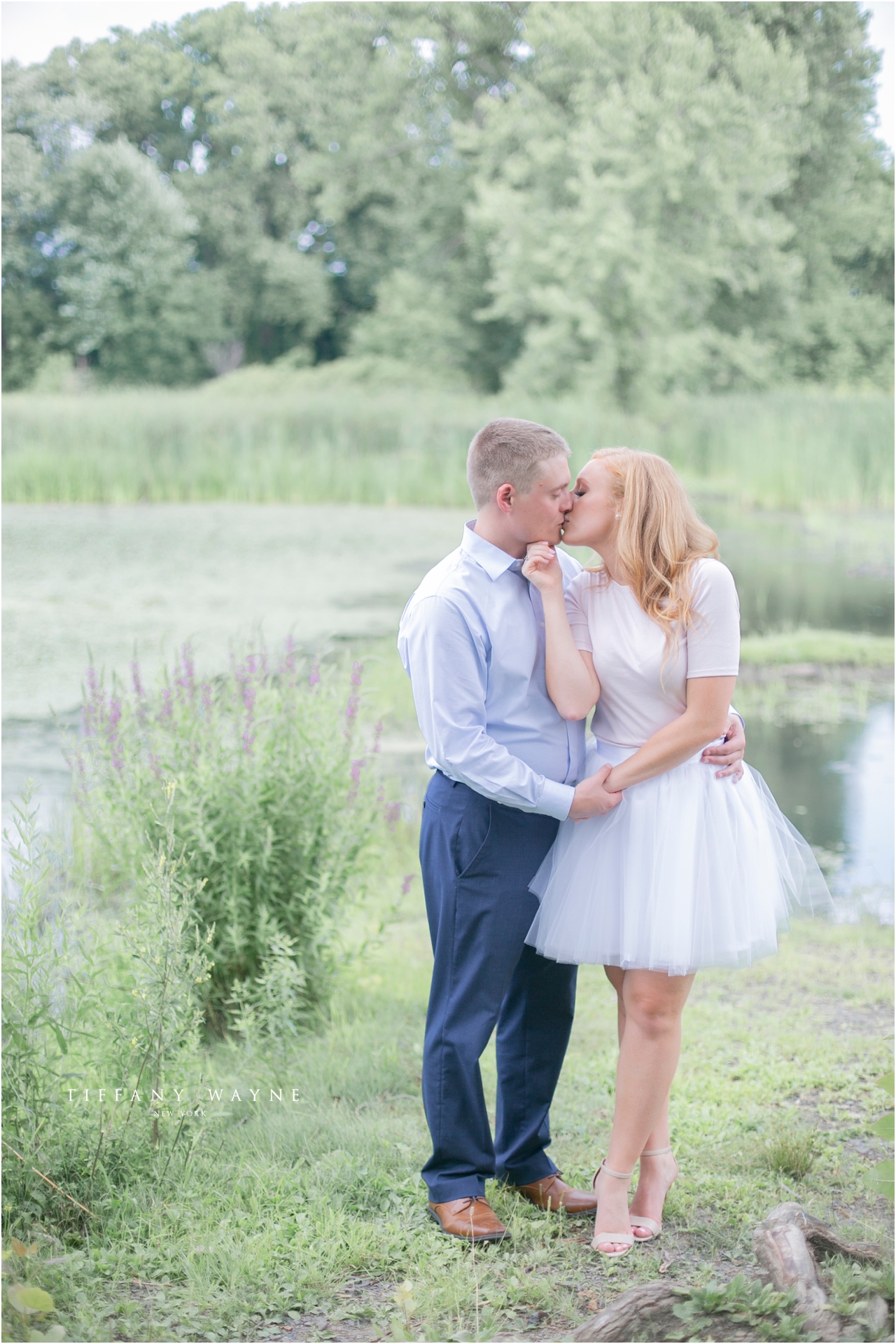 couple kisses New York engagement session with Tiffany Wayne Photography