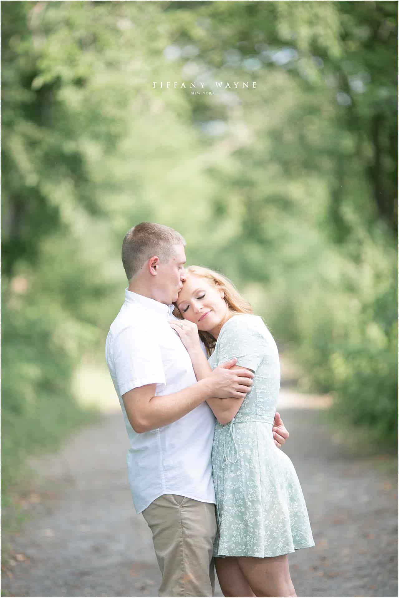 couple cuddles during New York engagement session 