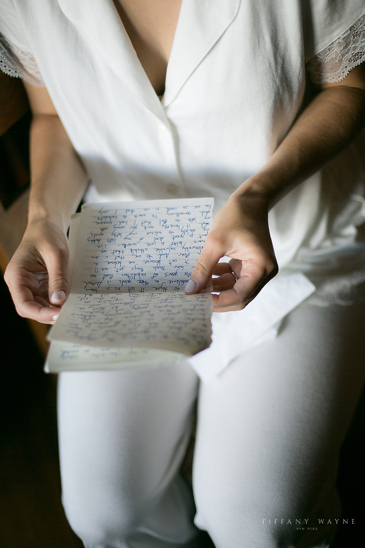bride reading letter before wedding day photographed by wedding photographer Tiffany Wayne