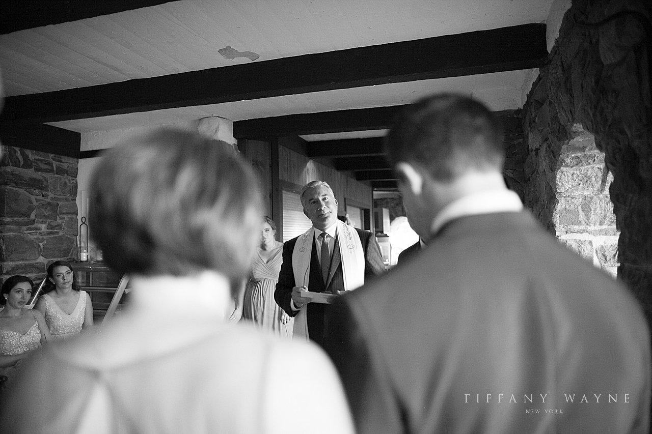 wedding ceremony in Grotto at Lake George Club by wedding photographer Tiffany Wayne