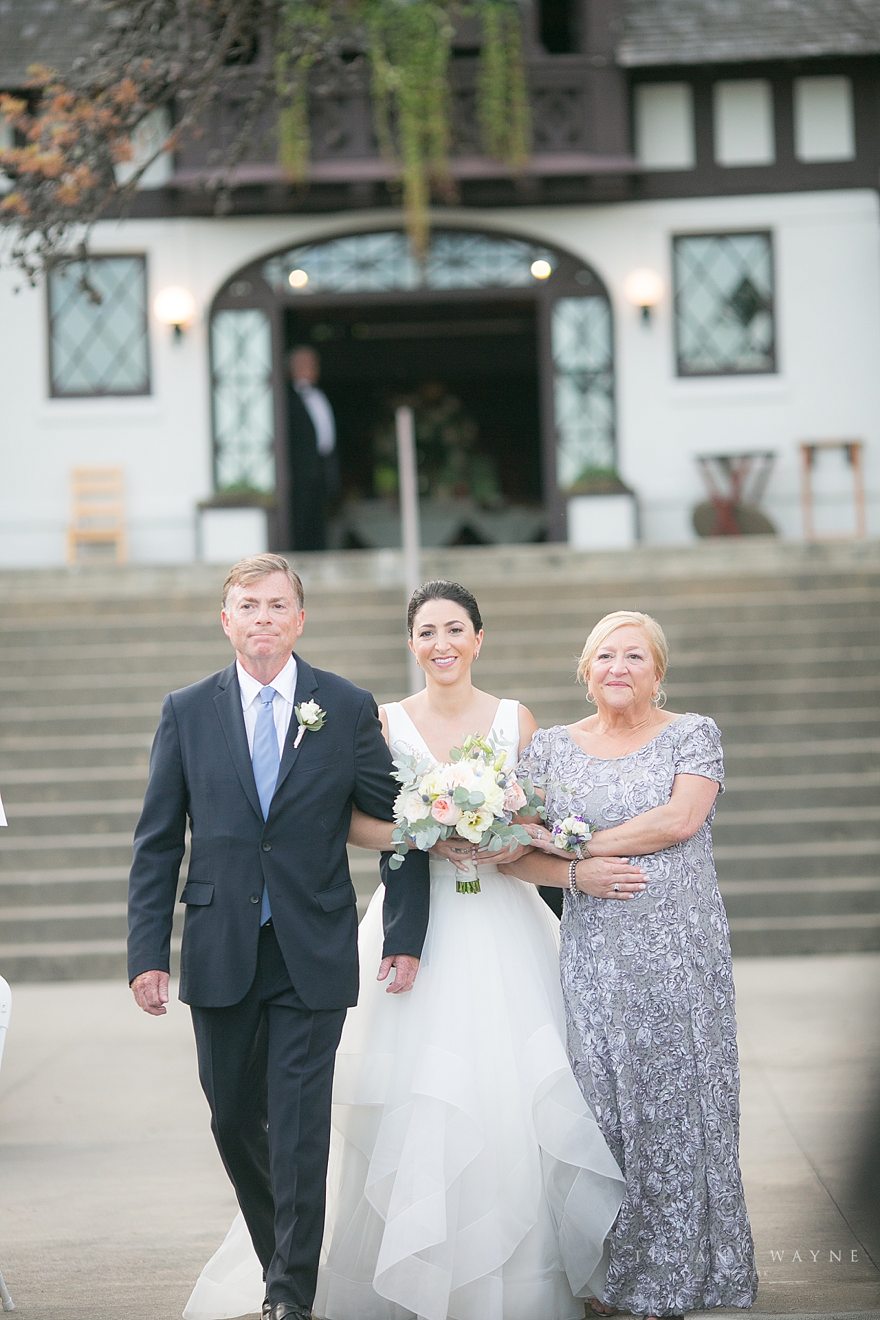 bride enters wedding ceremony with parents at Lake George Club by wedding photographer Tiffany Wayne