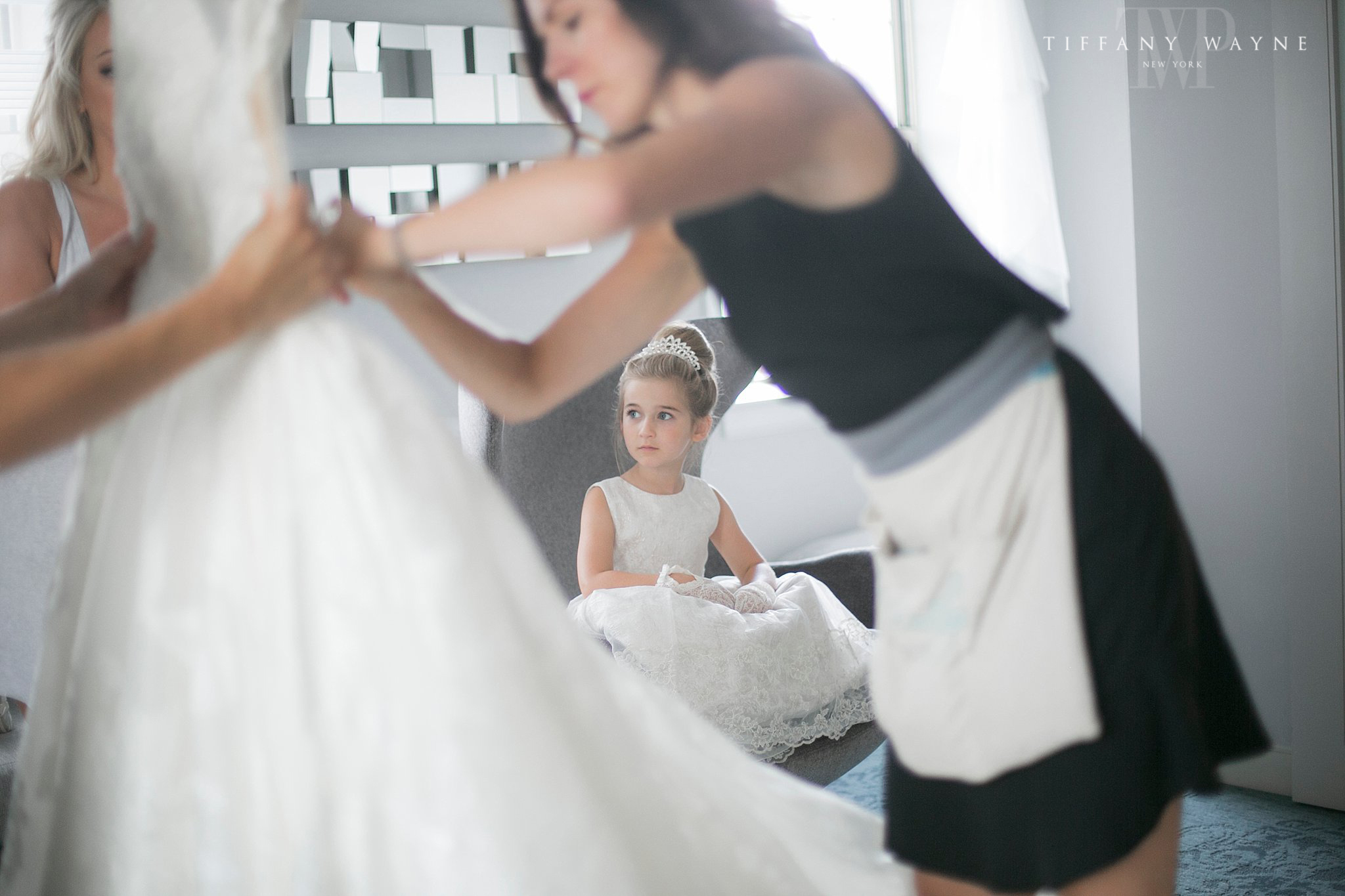 flower girl watches dress getting ready for Albany NY wedding day