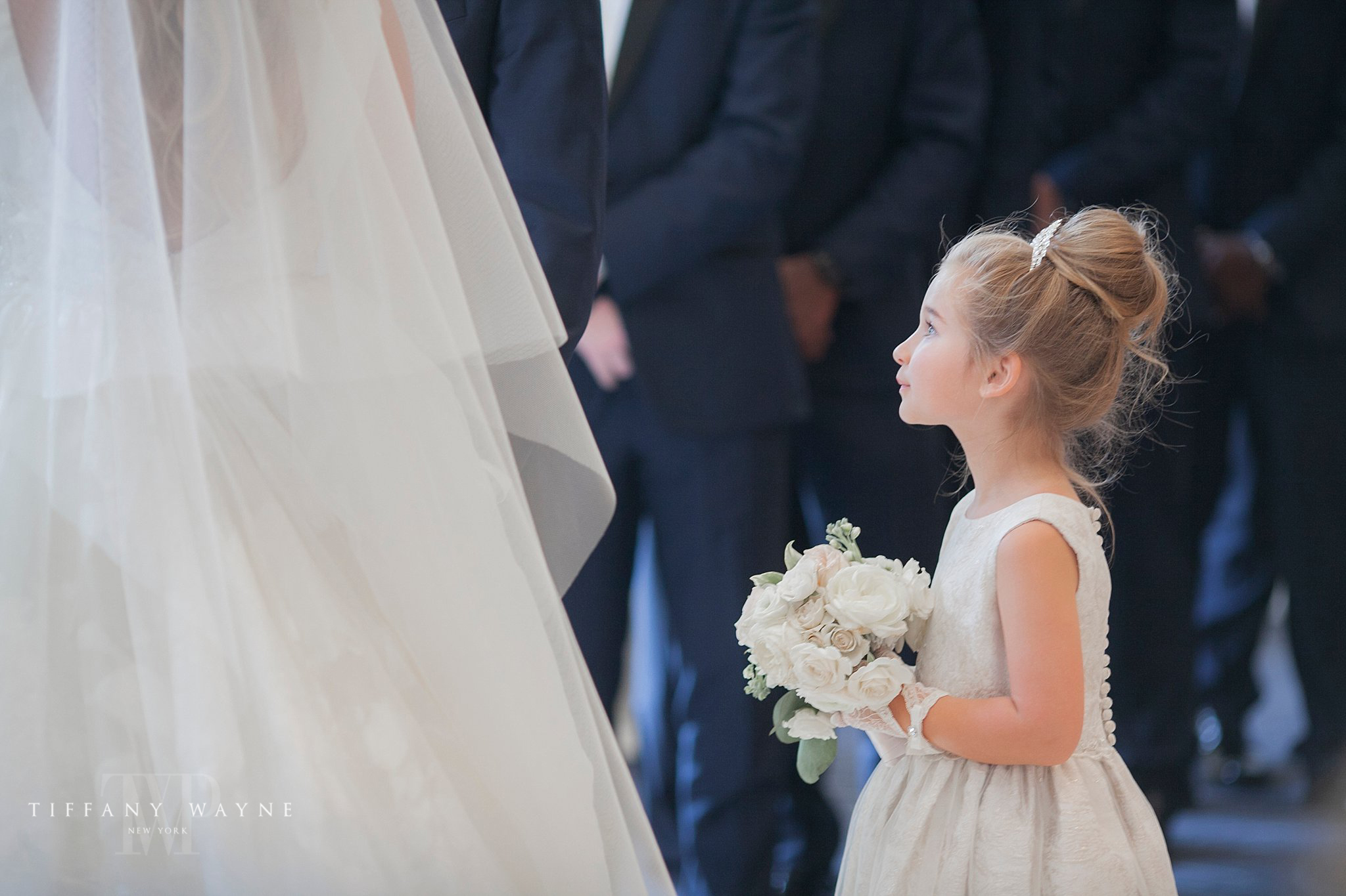 flower girl watches wedding ceremony at Renaissance Hotel photographed by Tiffany Wayne Photography