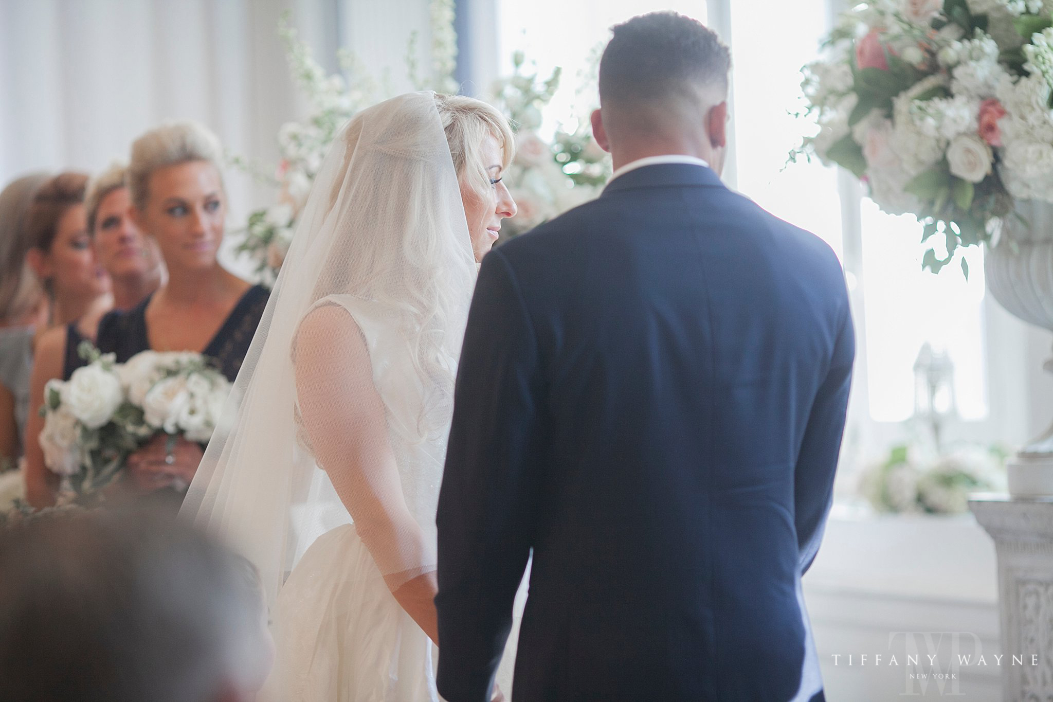 bride and groom during wedding ceremony photographed by Tiffany Wayne Photography