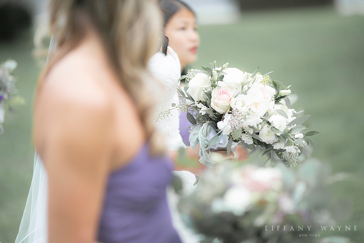 bridesmaids hold beautiful ivory bouquet for NY wedding day photographed by wedding photographer Tiffany Wayne