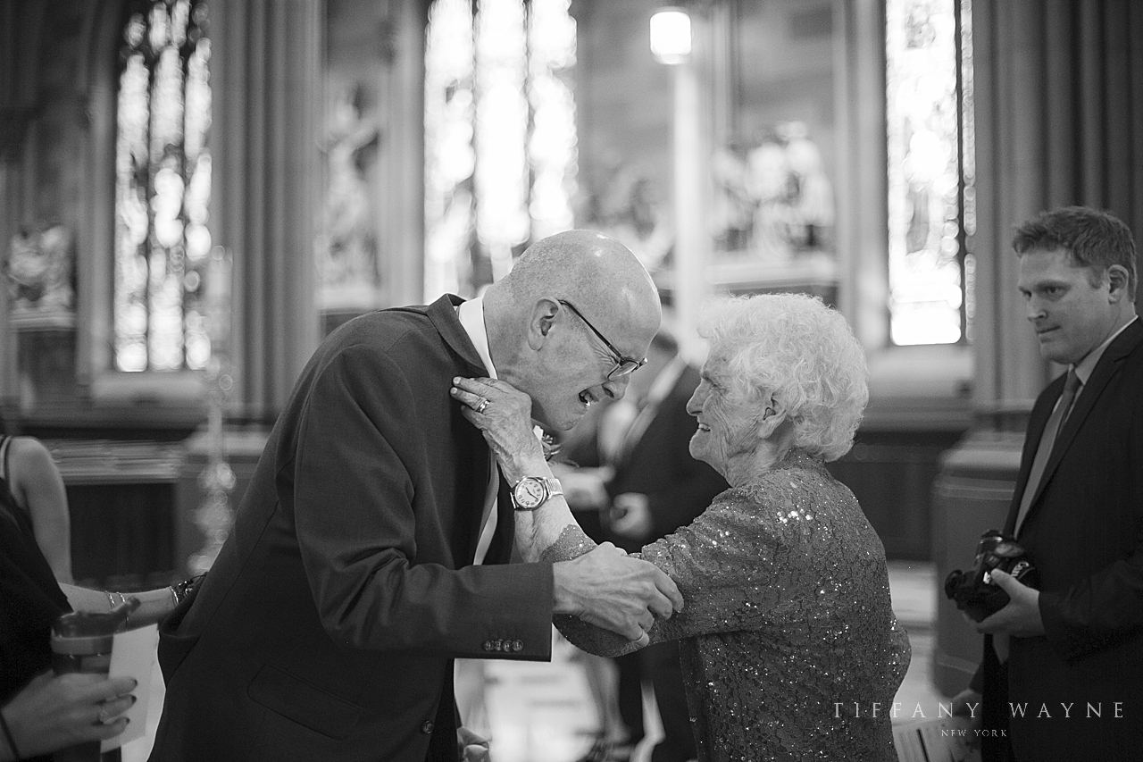 family greet at church before wedding day photographed by wedding photographer Tiffany Wayne