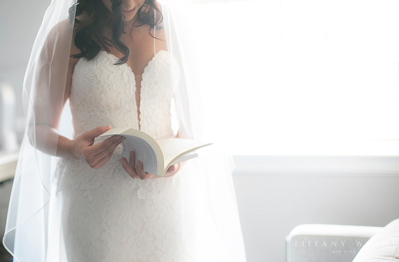 bride reads before NY wedding photographed by New York wedding photographer Tiffany Wayne