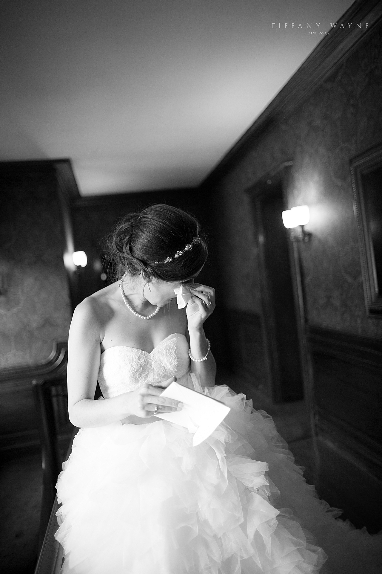 bride reads letter before wedding day photographed by wedding photographer Tiffany Wayne Photography