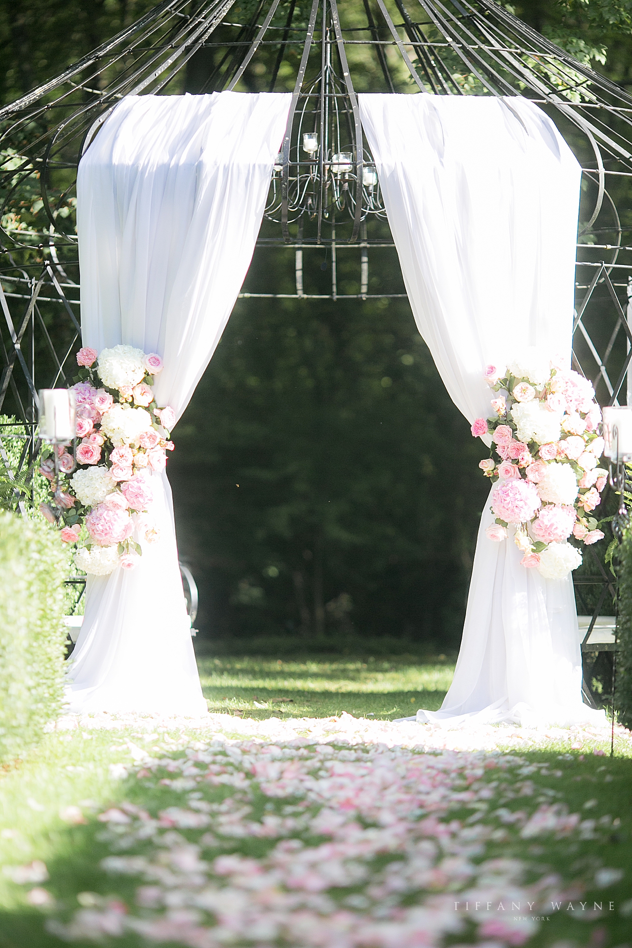 outdoor floral arbor for ceremony at Lord Thompson Manor