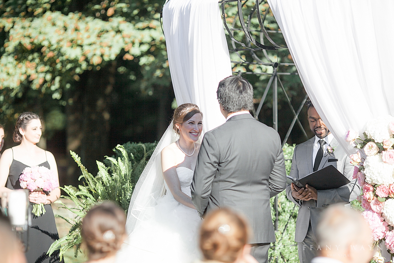 bride and groom during ceremony at Lord Thompson Manor photographed by wedding photographer Tiffany Wayne Photography