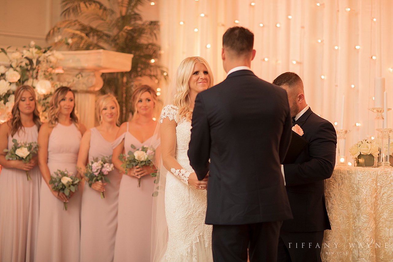 bride and groom exchange vows photographed by wedding photographer Tiffany Wayne Photography