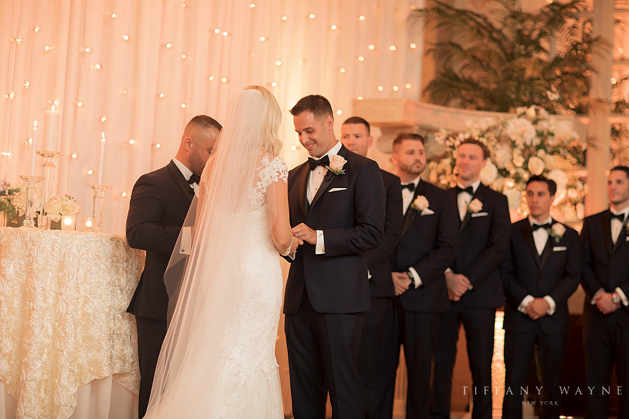 exchange rings at ceremony photographed by wedding photographer Tiffany Wayne Photography