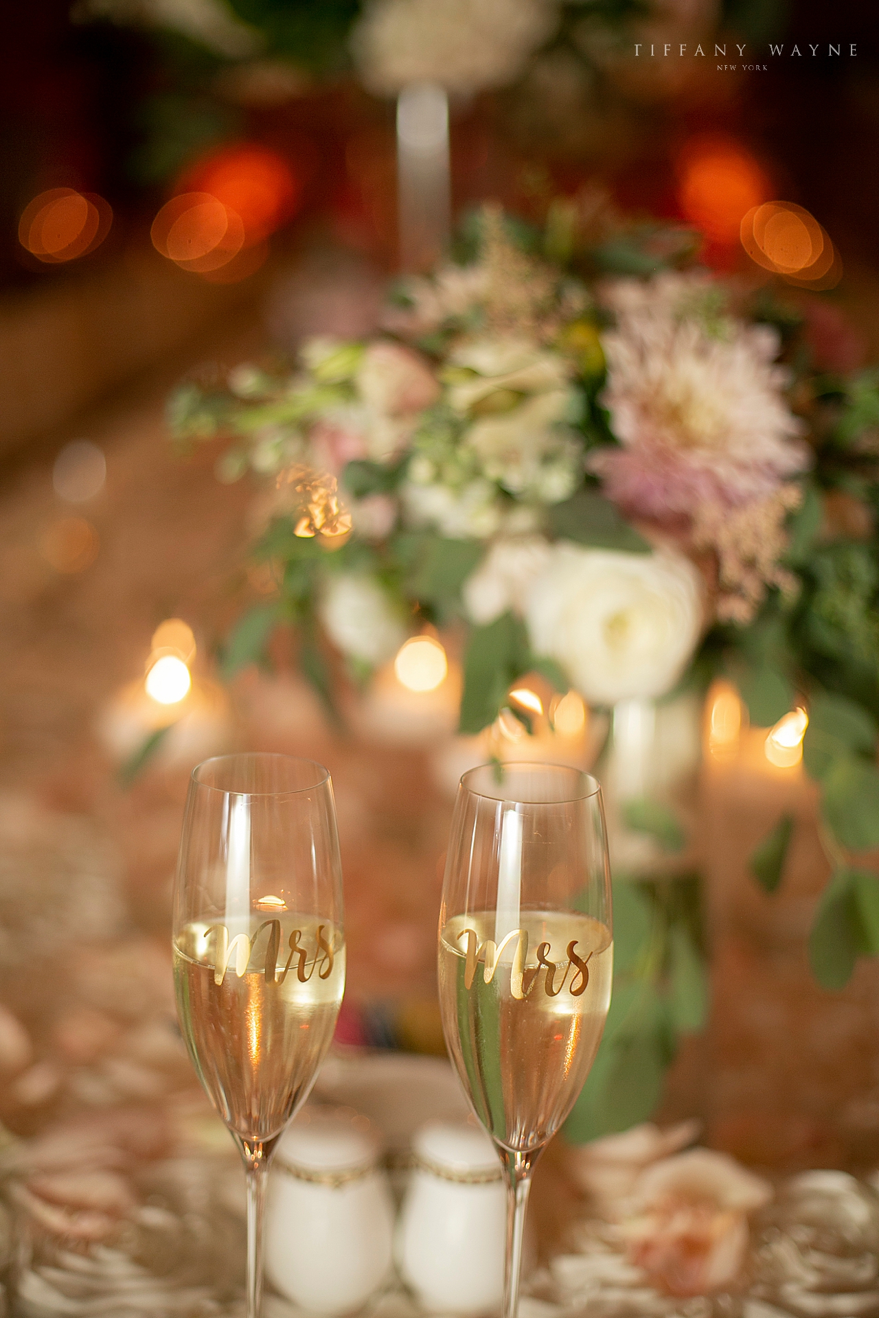 glasses of champagne photographed by wedding photographer Tiffany Wayne Photography