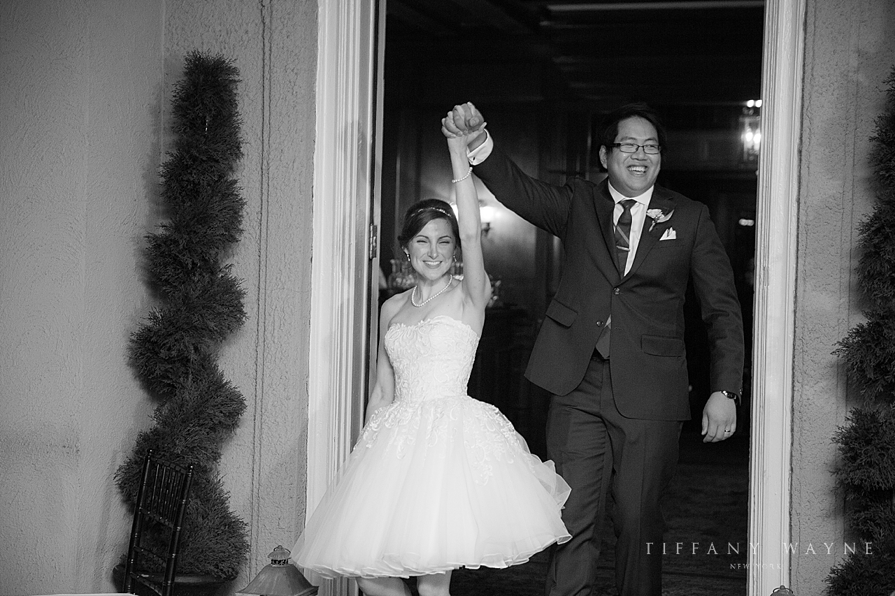 bride changes into second dress for reception photographed by wedding photographer Tiffany Wayne Photography