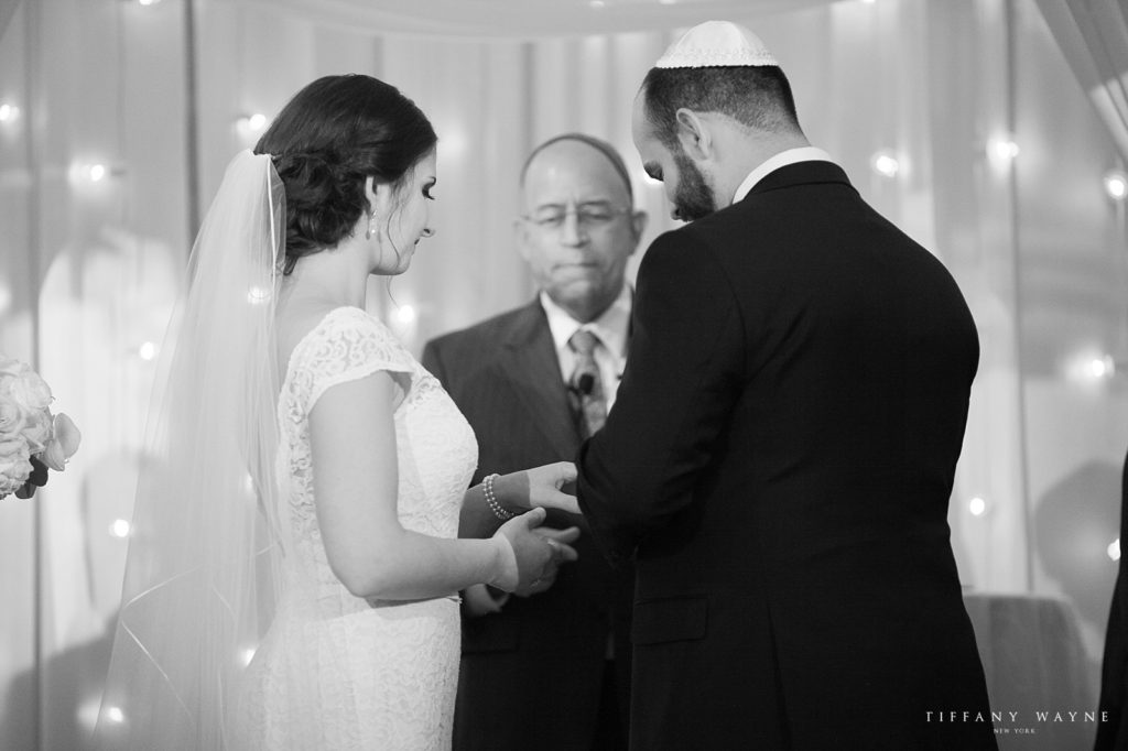 bride and groom exchange rings at Franklin NY wedding photographed by Tiffany Wayne, New York wedding photographer
