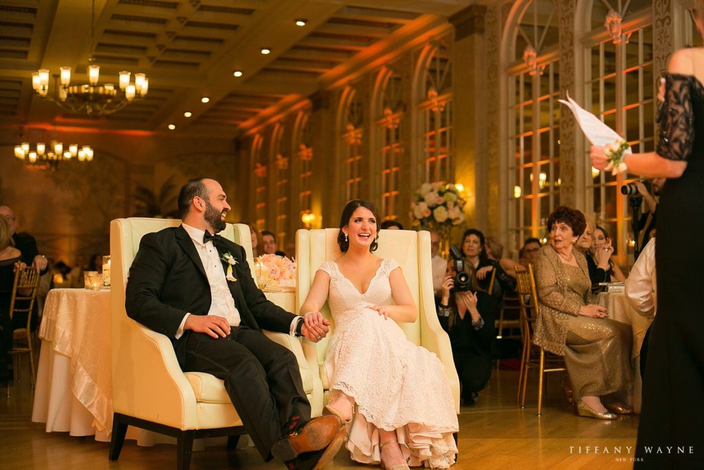 bride and groom listen to toast at Franklin Plaza photographed by NY wedding photographer Tiffany Wayne
